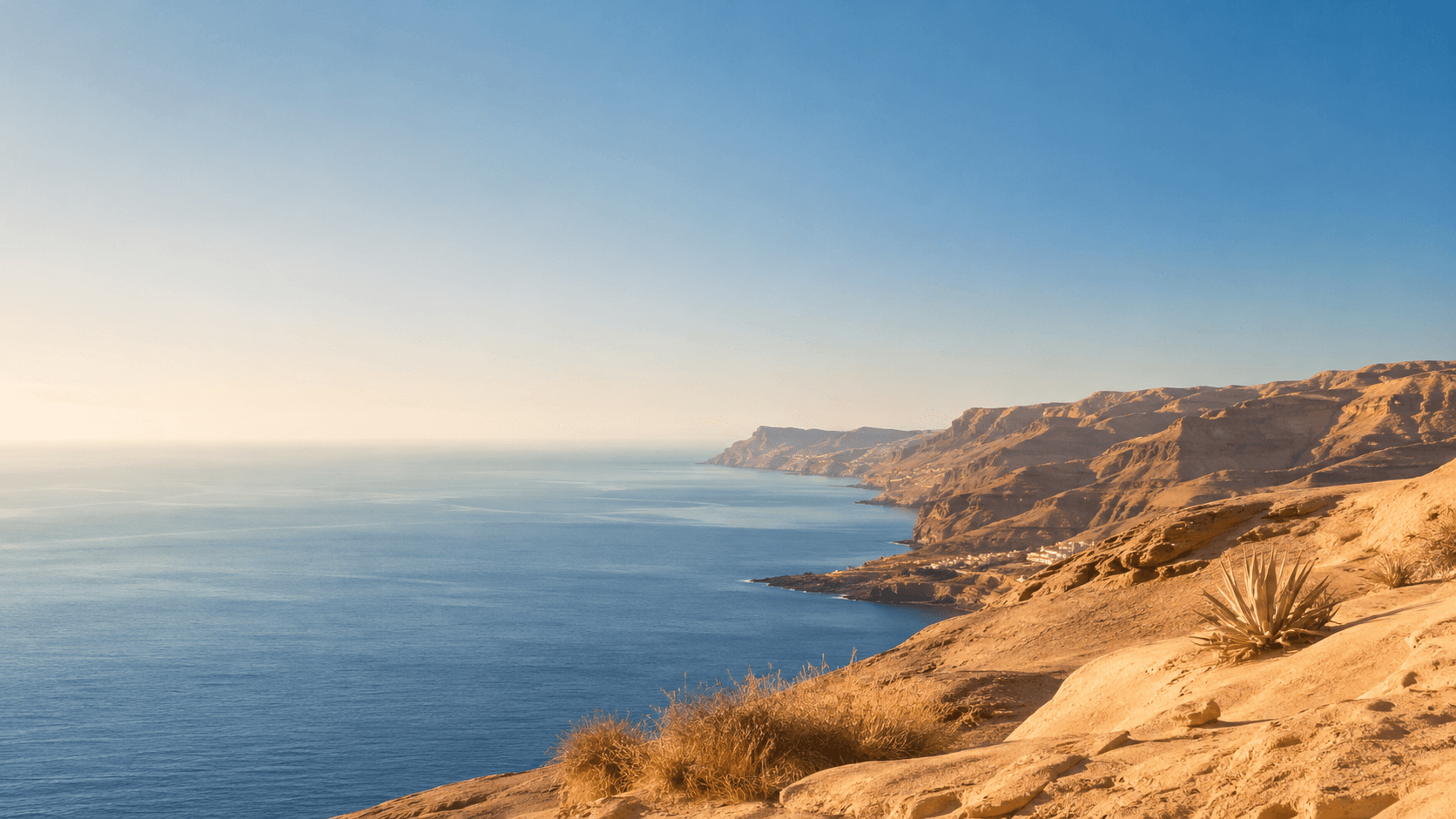 Gran Canaria coast with ocean, cliffs and warm evening light
